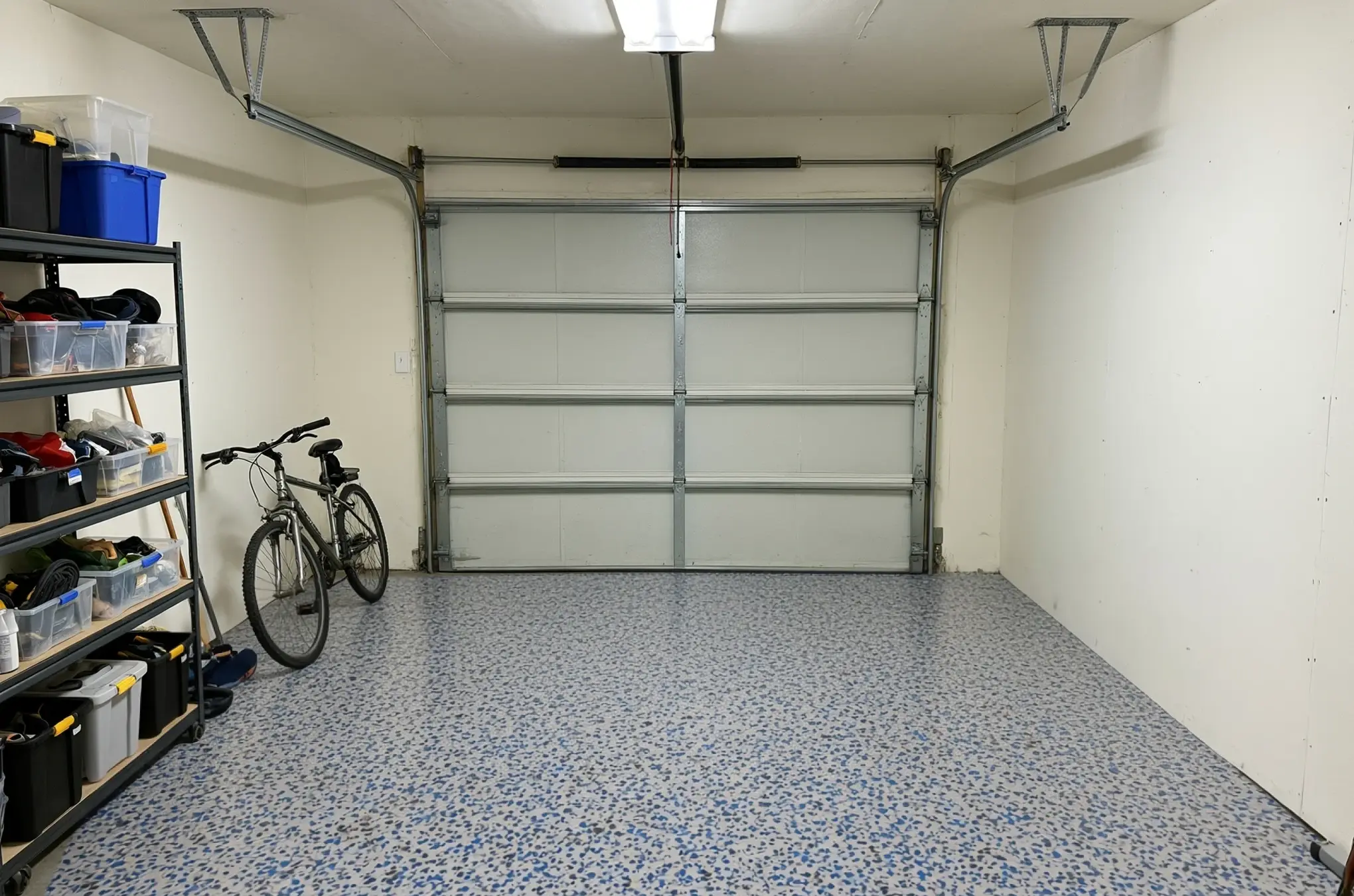 A garage floor finished in ANVIL Arc Blue